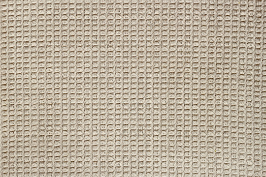Waffle fabric with visible texture copy space for text, web print design elements. Closeup of light natural cotton texture pattern for backdrop