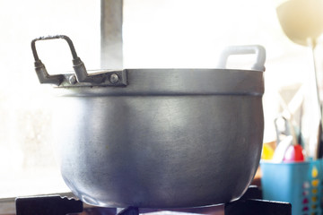 Food boiler in the kitchen on the stove.