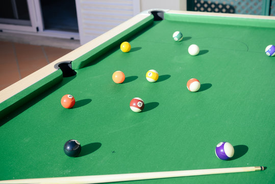 Pool colorful balls on the table sunshine outdoors backgroud. Close up view photo of leisure luxury lifestyle poolgame