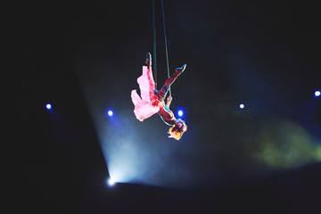 Performance of the girl aerial acrobat in the circus.