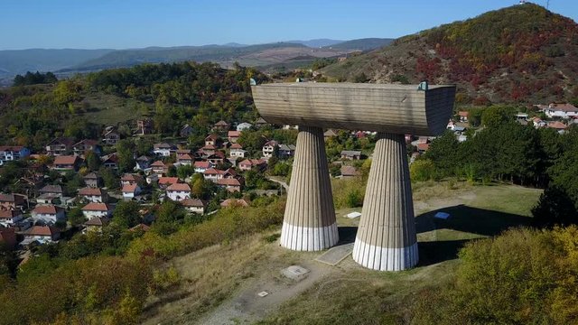 Aerial view of Spomenik built on a hill overlooking Mitrovica city in Kosovo