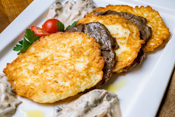 potato pancakes with beef medallions