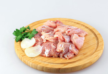 raw chicken goulash on white background