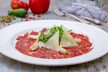 Beef carpaccio with Parmesan and arugula