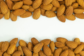 almond nuts on white background with copyspace .