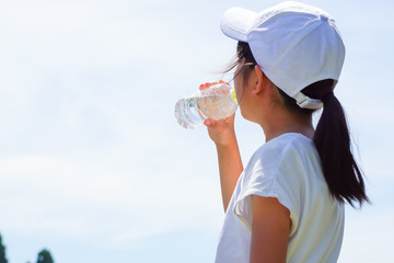 A woman or a girl who drinks water. Image of hydration, health, beauty, sports etc....