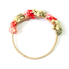 wreath of wild flowers on white background