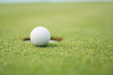 Blerred Close up of golf ball on green