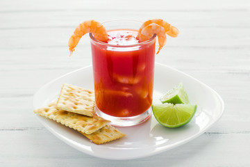 caldo de camaron, consome de camarones, Shrimp cocktail with lemon and salted cookies mexican sea food in mexico