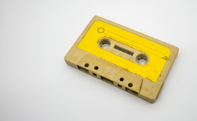 close up of old and dirty vintage audio tape cassette isolated on white