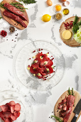 Pieces of stroganina on plate