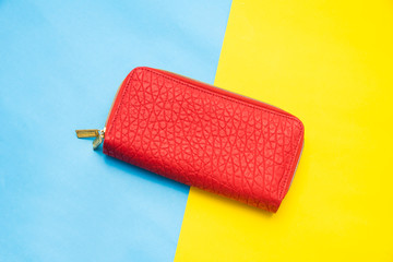 Top view for Red wallet on a colorful background.