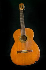 Fototapeta na wymiar An old acoustic guitar