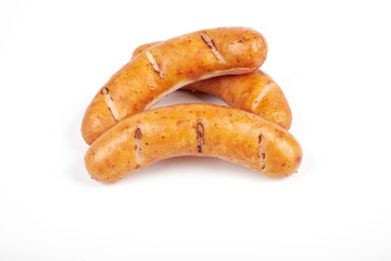 Grilled sausages isolated on a white background