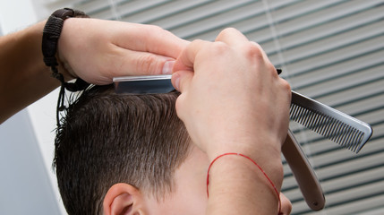 hairdresser does a hairdo for a child