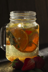 Refreshing summer cocktail with crushed ice and citrus fruits