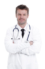 Handsome mature doctor is looking at camera while standing with folded arms