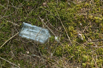 Obraz premium Glass bottle pollution