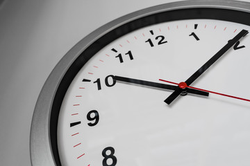 Closeup clock on the wall for Business hourse on time concept.