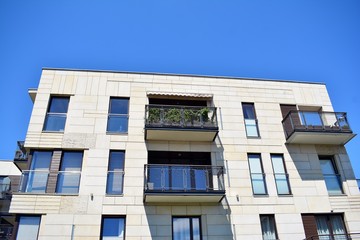 Brand new apartment building on sunny day