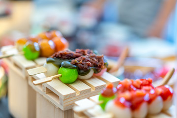 Mitarashi dango. Dango Japanese dessert, dumpling and sweet made from rice flour, covered with a sweet soy sauce glaze. This dango is also sold in supermarkets and convenience stores in Japan.