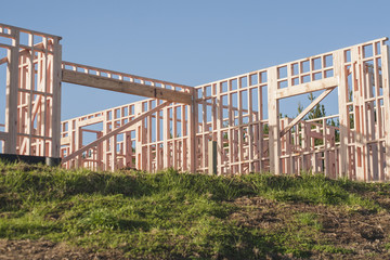 Fototapeta na wymiar the construction of a frame wooden house 