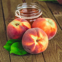 fresh peaches on wooden table