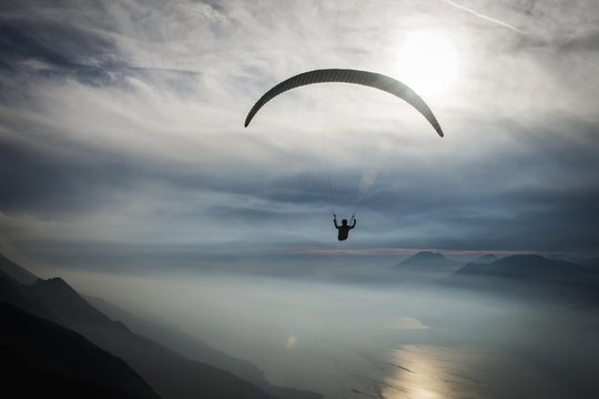 Paraglider over Lake Garda in Malcesine, evening mood Monte Baldo, Veneto, Italy, Europe