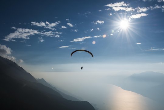 Paragliding over Monte Baldo on Lake Garda, aerial view, inversion weather, Veneto, Italy, Europe