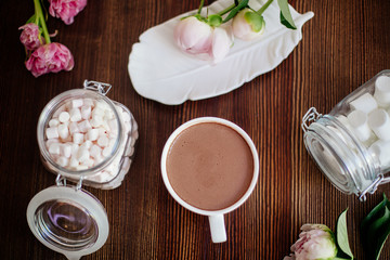 Cocoa with marshmallow and flowers.