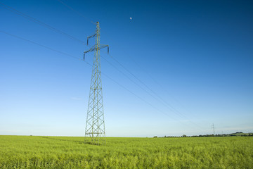 Electric column on green field