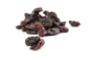 Dark raisins isoalted on white background