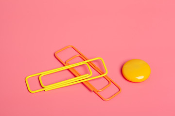 Office clips on bright pink background
