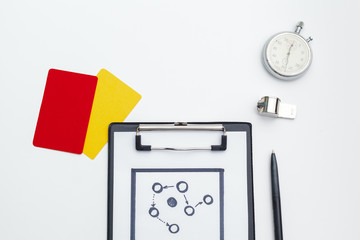 two penalty cards and a whistle for the referee