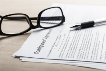 Close up shot of Eyeglasses  on contract document papers business concept