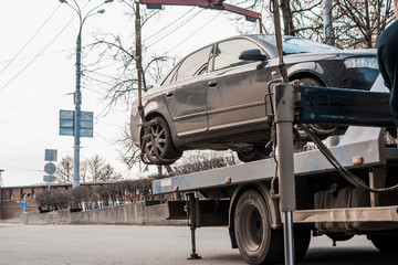 Evacuation of the car in the city center. The car is lifted to the tow truck