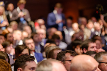 People attend business conference in the congress hall