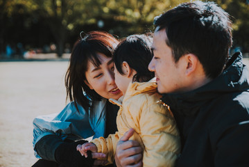 Happy japanese family spending time outdoor