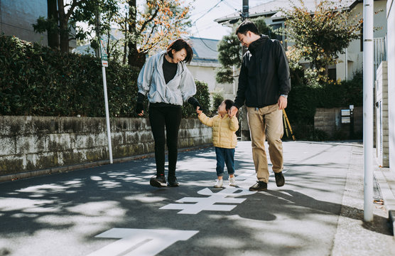 Happy japanese family spending time outdoor