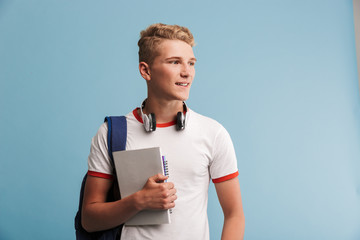 Portrait of a smiling casual teenage boy with backpack © Drobot Dean