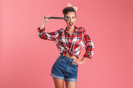 Amazing Young Pin-up Woman Holding Wrench.