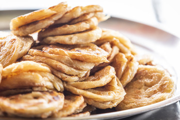 fried Roti placed on tray as street food