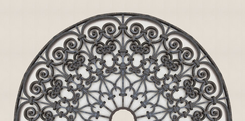 Old italian wrought iron grating with floral decorations