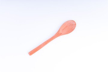Wooden spoon isolated on white background