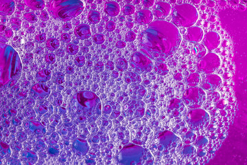 Purple, pink, and magenta bubbles. Close-up abstract graphic background image.