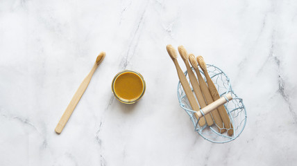 toothbrush and turmeric paste and coconut oil (natural)