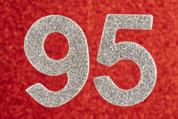 Number ninety-five silver color over a red background. Anniversary.