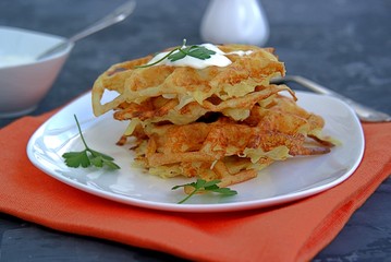 Crispy waffle hash browns or pancakes from shredded potatoes. Served with sour cream