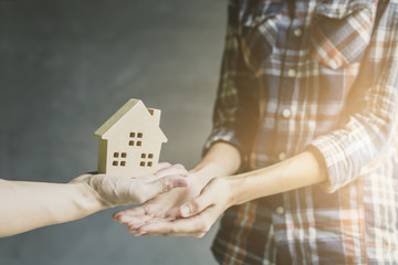 agent of bank gives new house to owner, buying and selling home concept