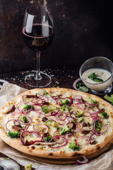 Broccoli pizza with sour cream sauce